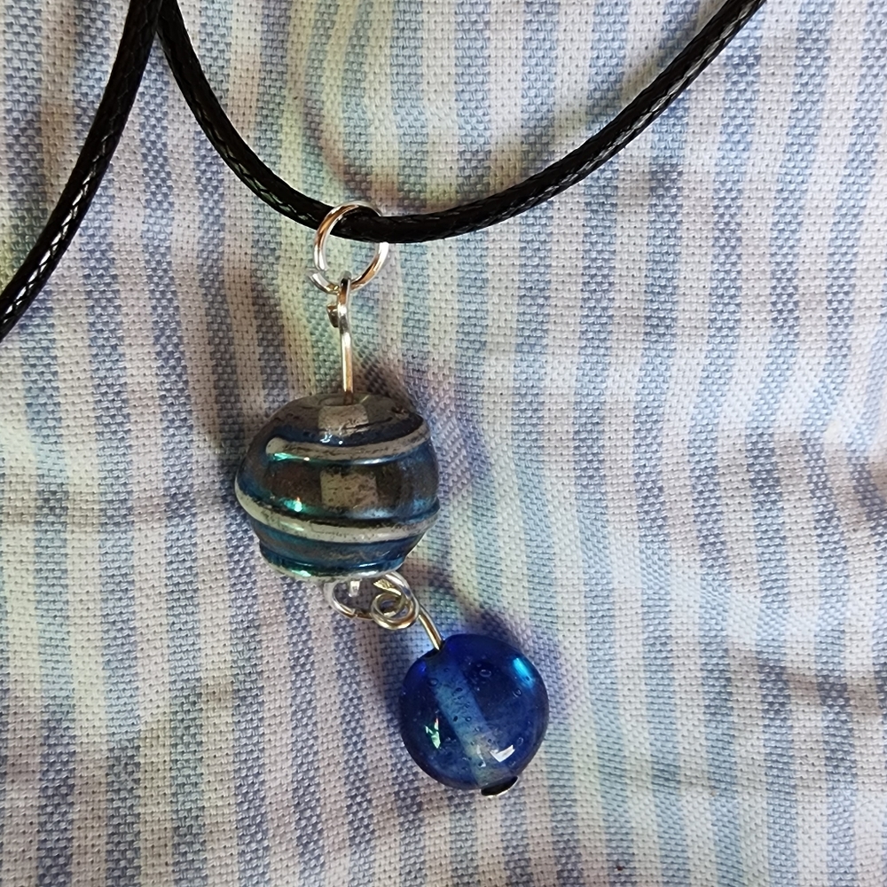 Blue and silver colored necklaces